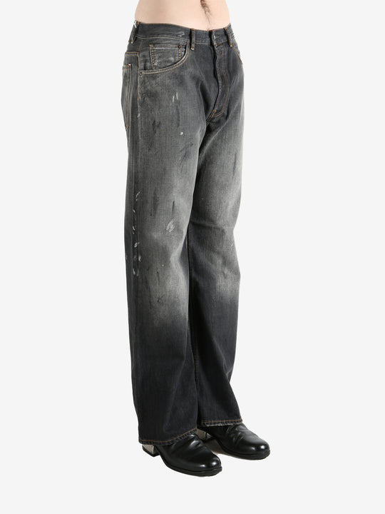 Black pant worn by a person, showing the pant's fit