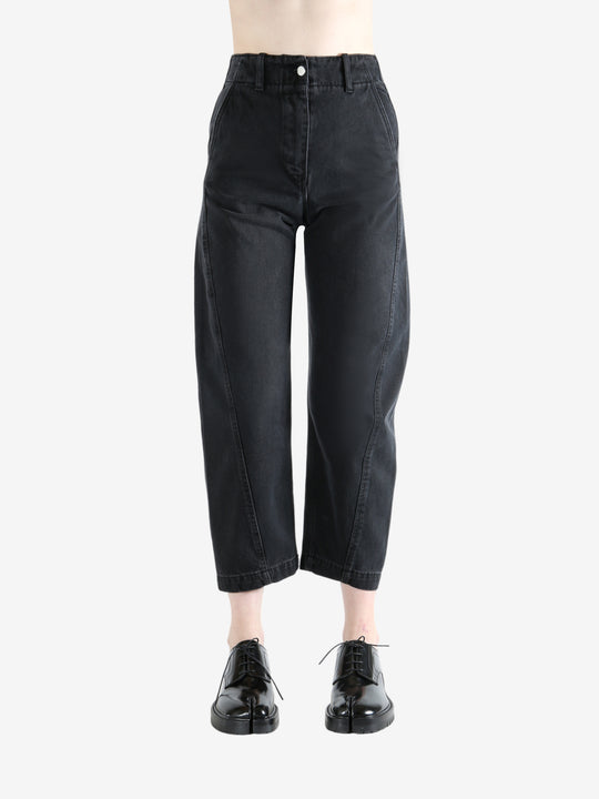 Black pants worn by a person, showing the pants's fit