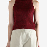 Red tops worn by a person, showing the top fit