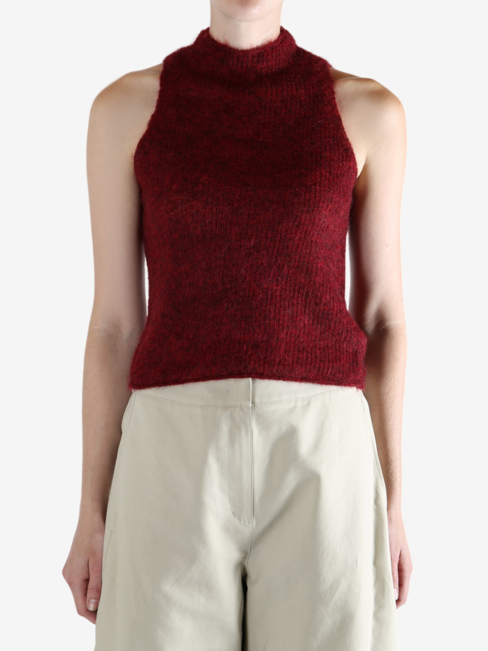 Red tops worn by a person, showing the top fit