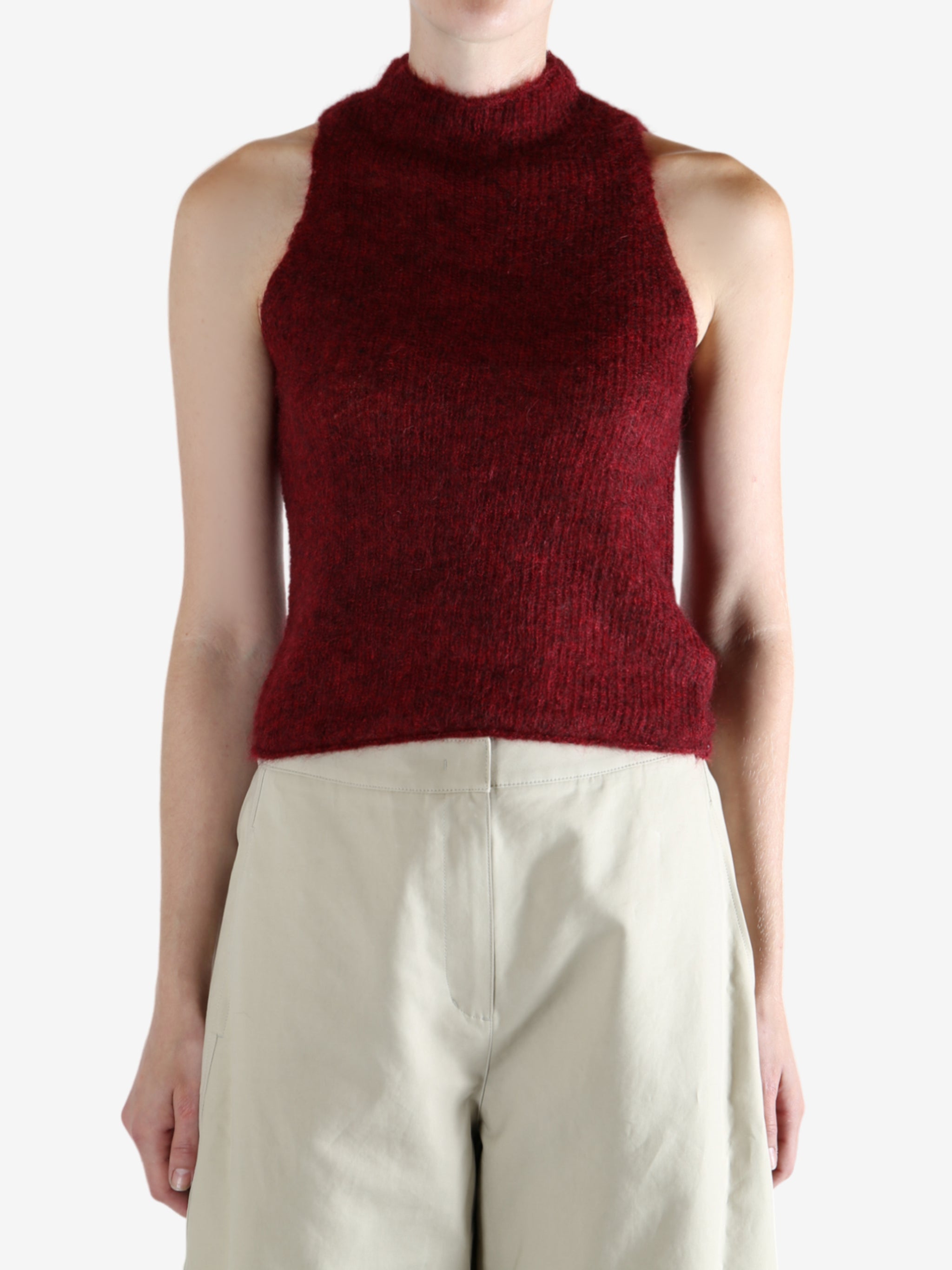 Red tops worn by a person, showing the top fit