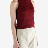 Red tops worn by a person, showing the top fit