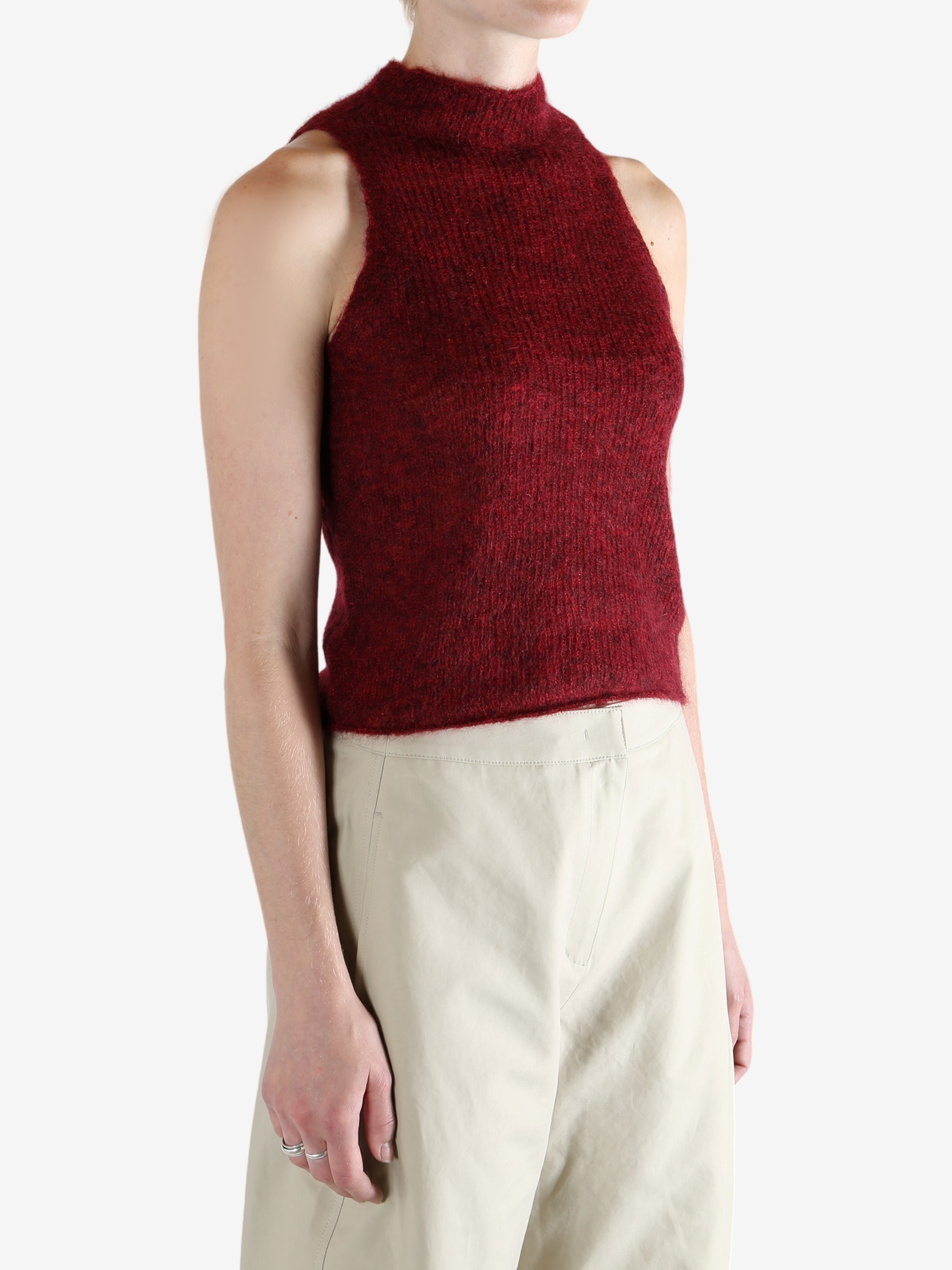 Red tops worn by a person, showing the top fit