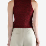 Red tops worn by a person, showing the top fit