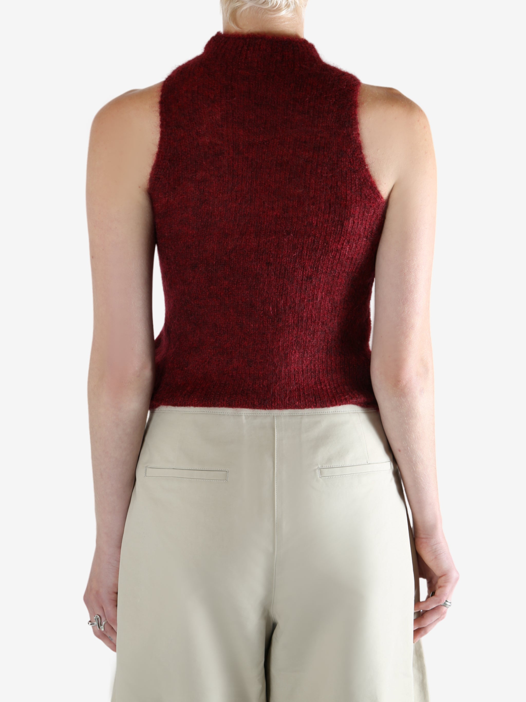 Red tops worn by a person, showing the top fit