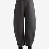 Grey pants  worn by a person, showing the pants fit