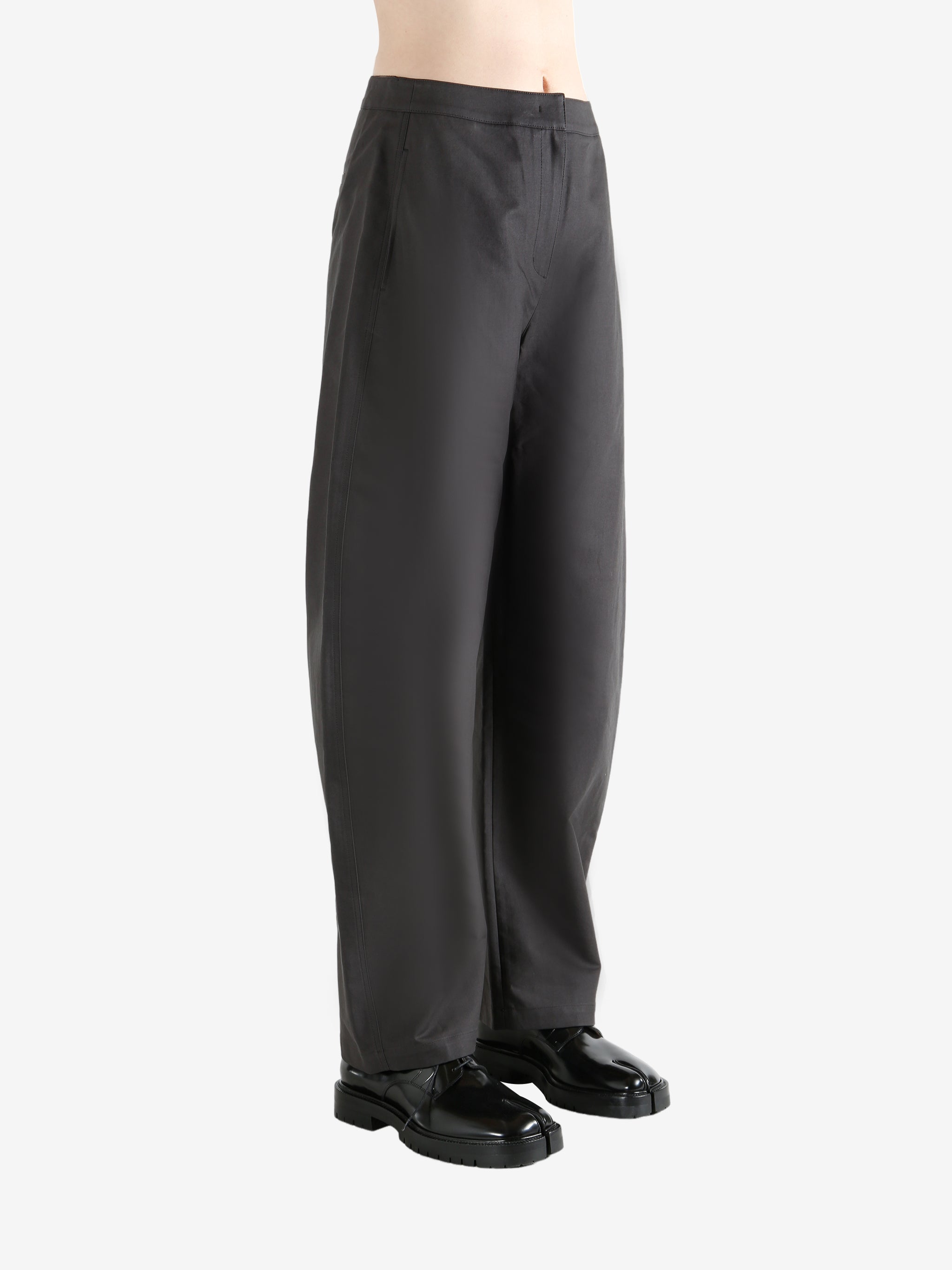 Grey pants  worn by a person, showing the pants fit