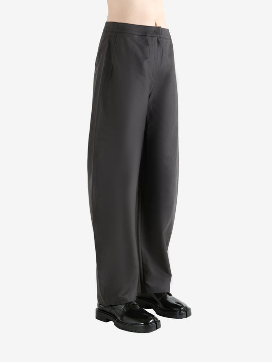 Grey pants  worn by a person, showing the pants fit