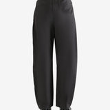 Grey pants  worn by a person, showing the pants fit