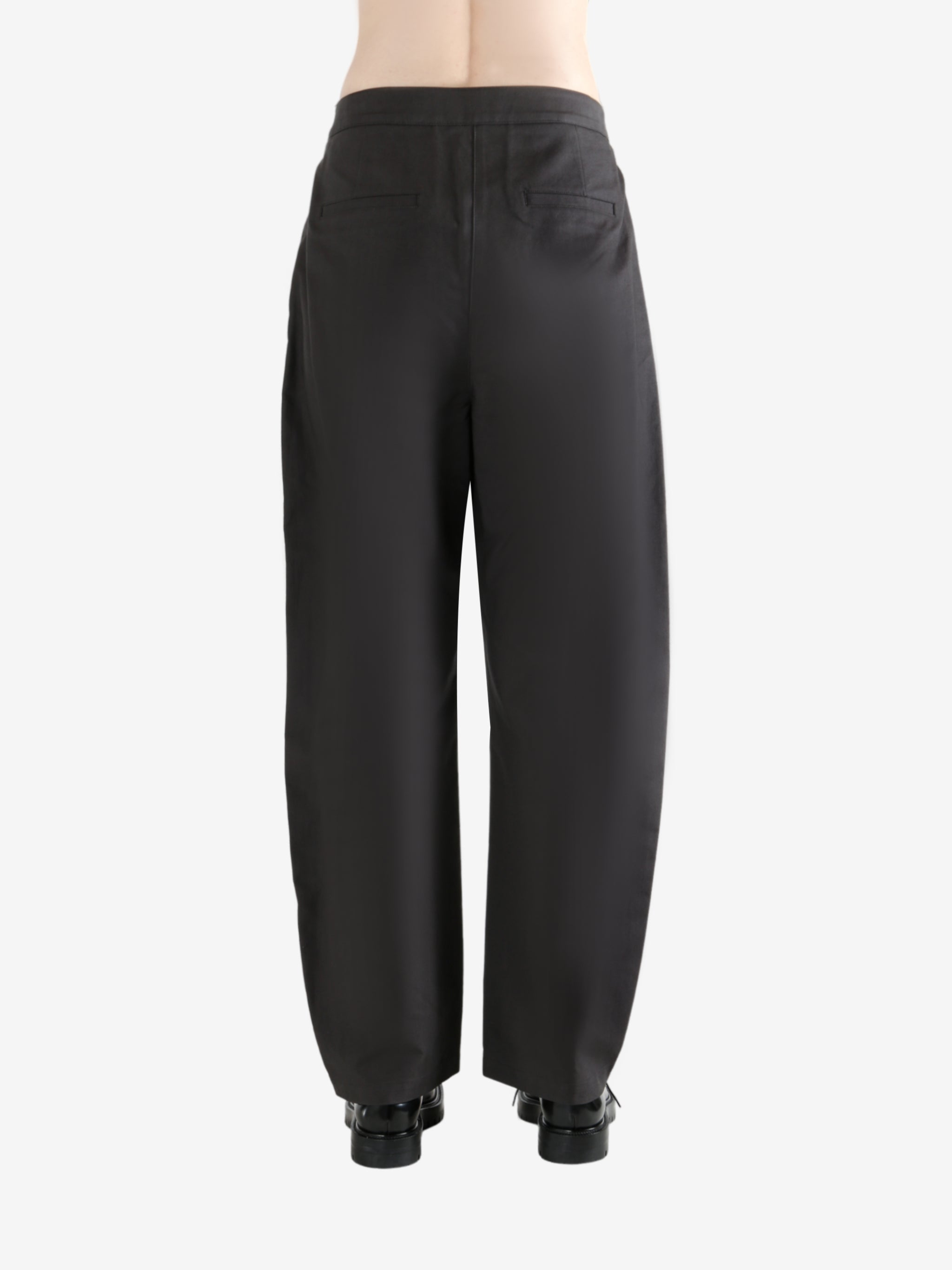 Grey pants  worn by a person, showing the pants fit