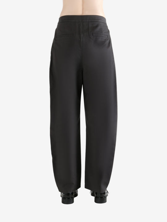 Grey pants  worn by a person, showing the pants fit