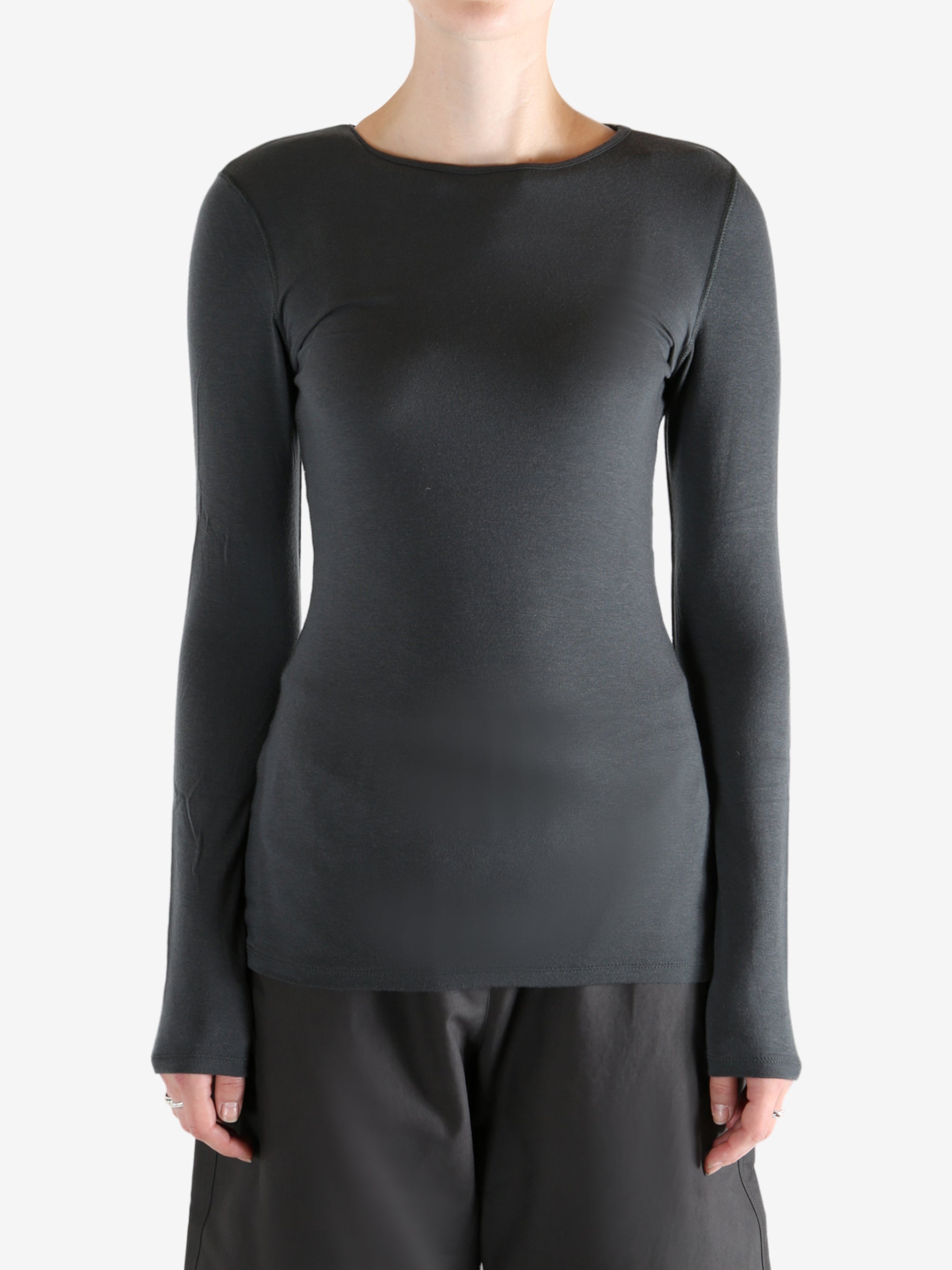 Grey shirts worn by a person, showing the shirts fit