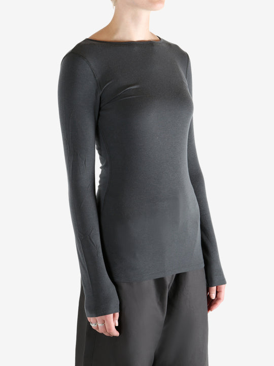 Grey shirts worn by a person, showing the shirts fit