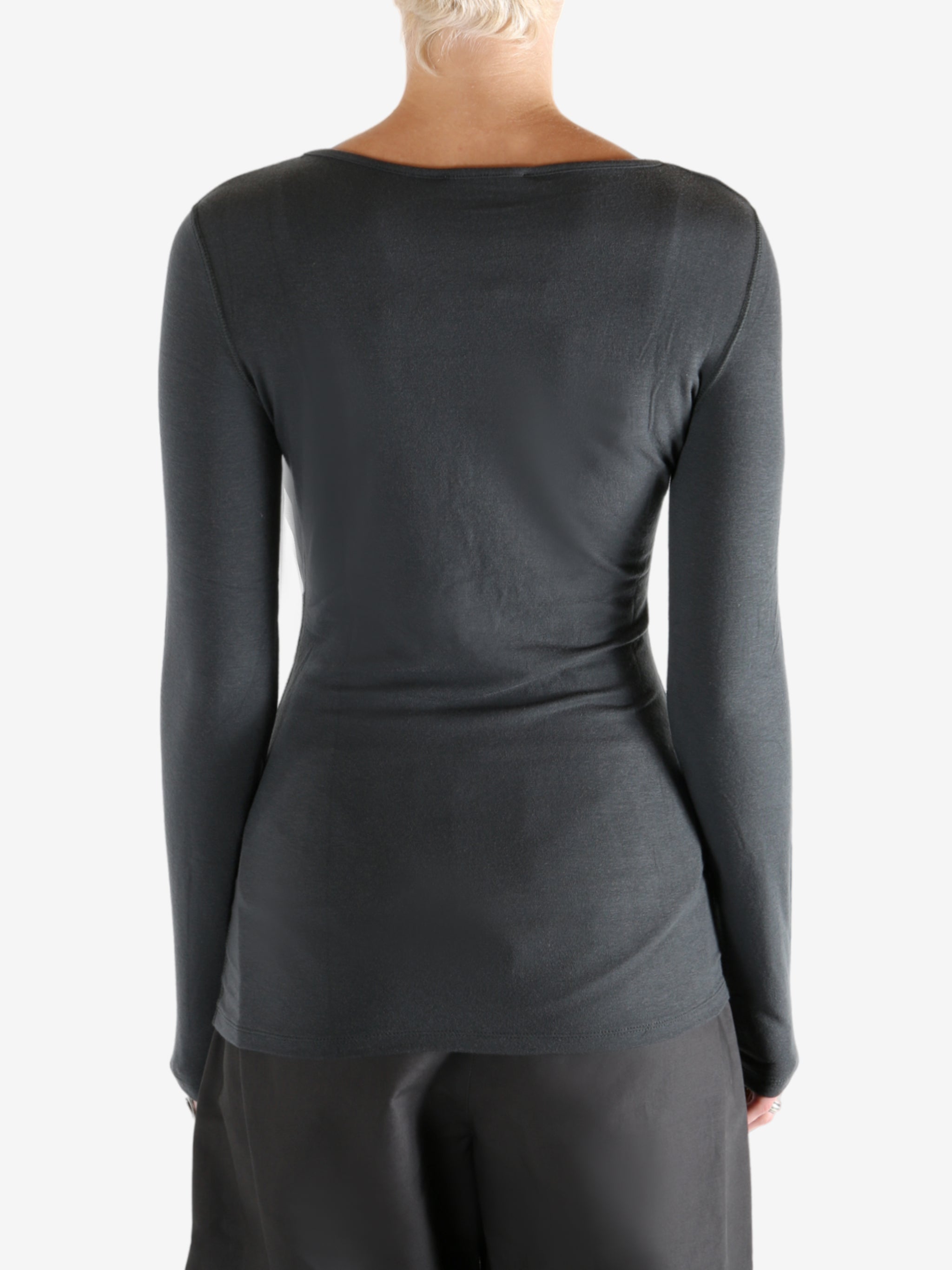 Grey shirts worn by a person, showing the shirts fit