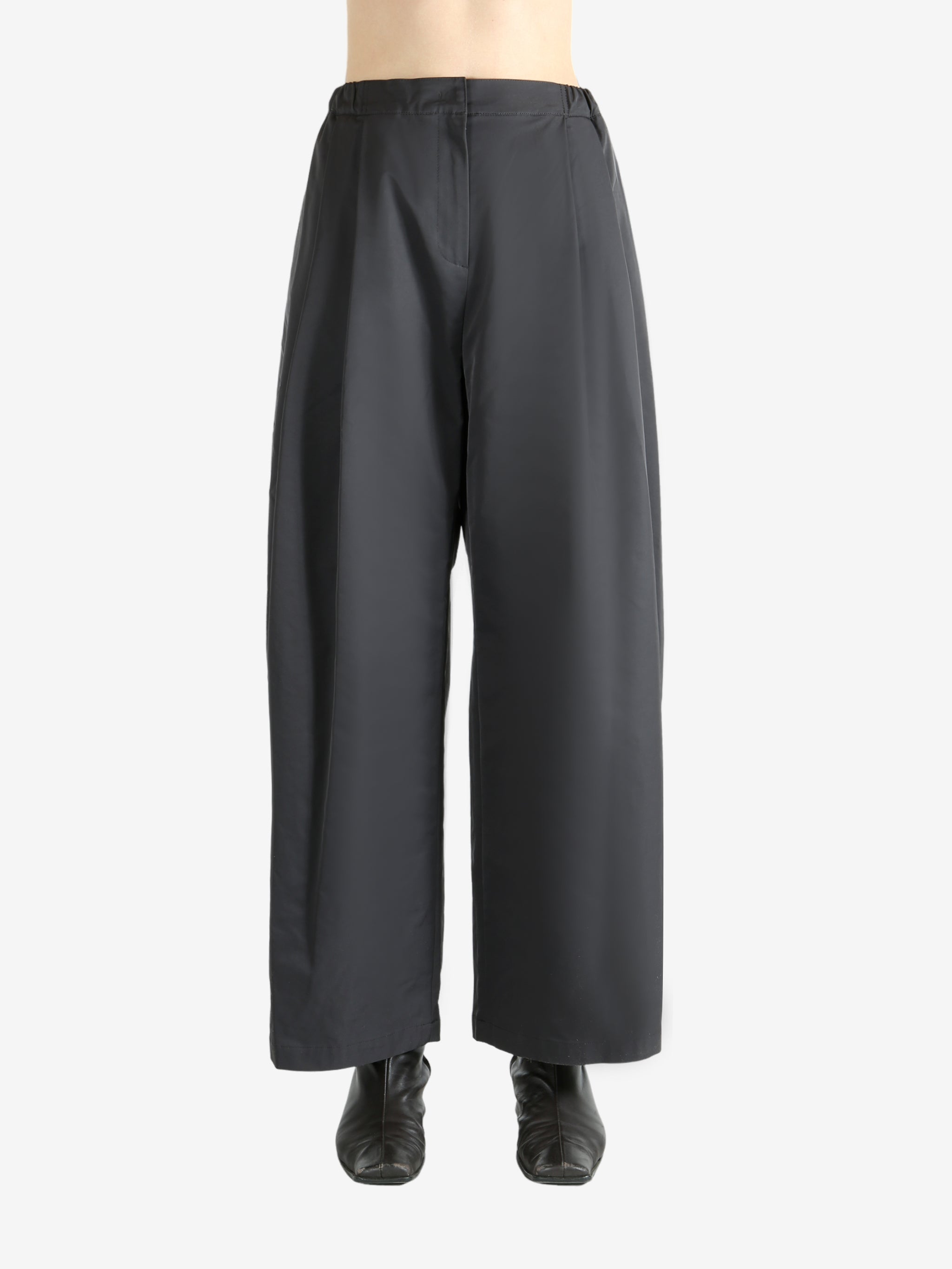 Grey pants worn by a person, showing the pants fit