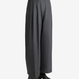 Grey pants worn by a person, showing the pants fit