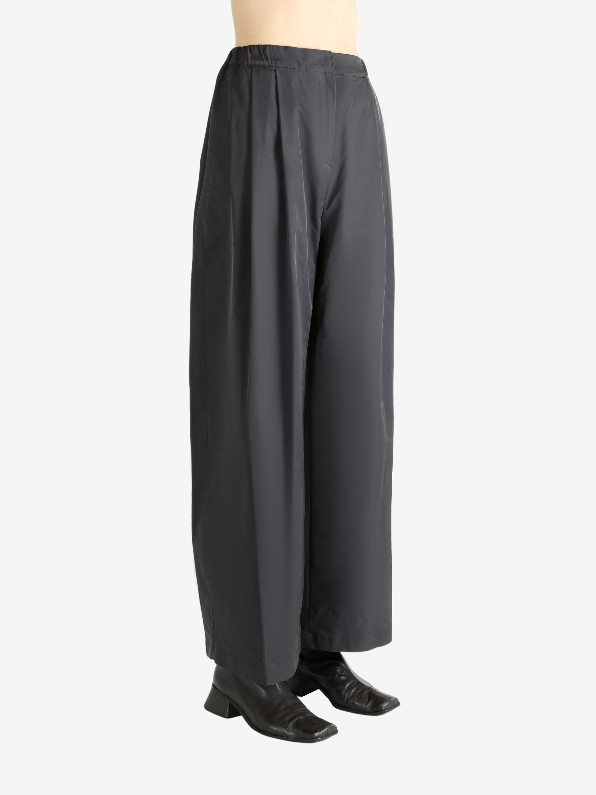 Grey pants worn by a person, showing the pants fit