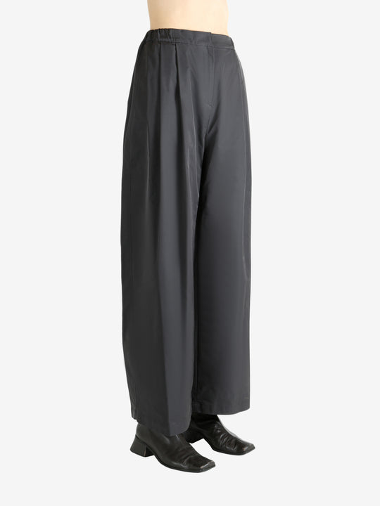 Grey pants worn by a person, showing the pants fit