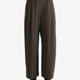 Green pants worn by a person, showing the pants fit