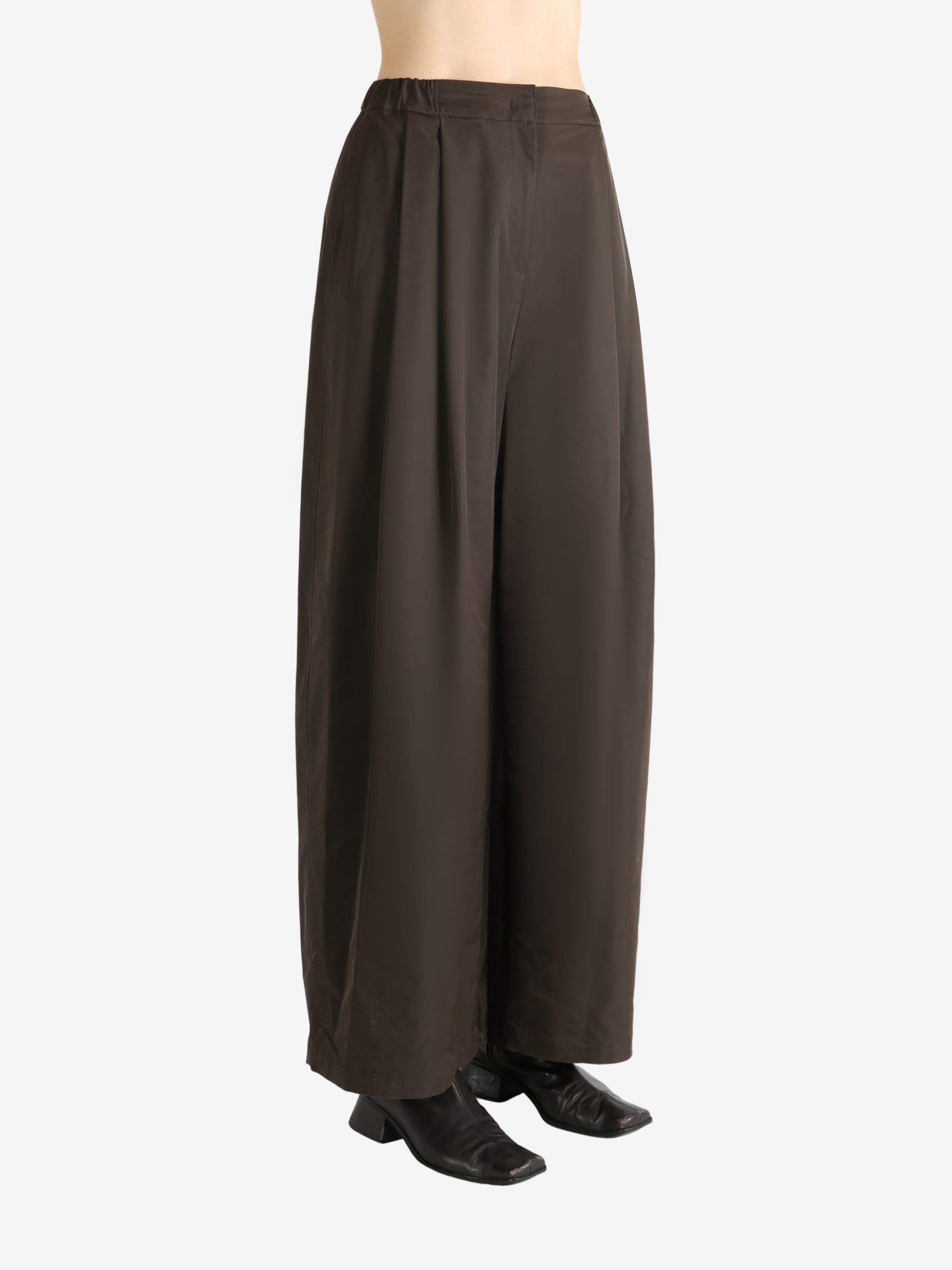 Green pants worn by a person, showing the pants fit