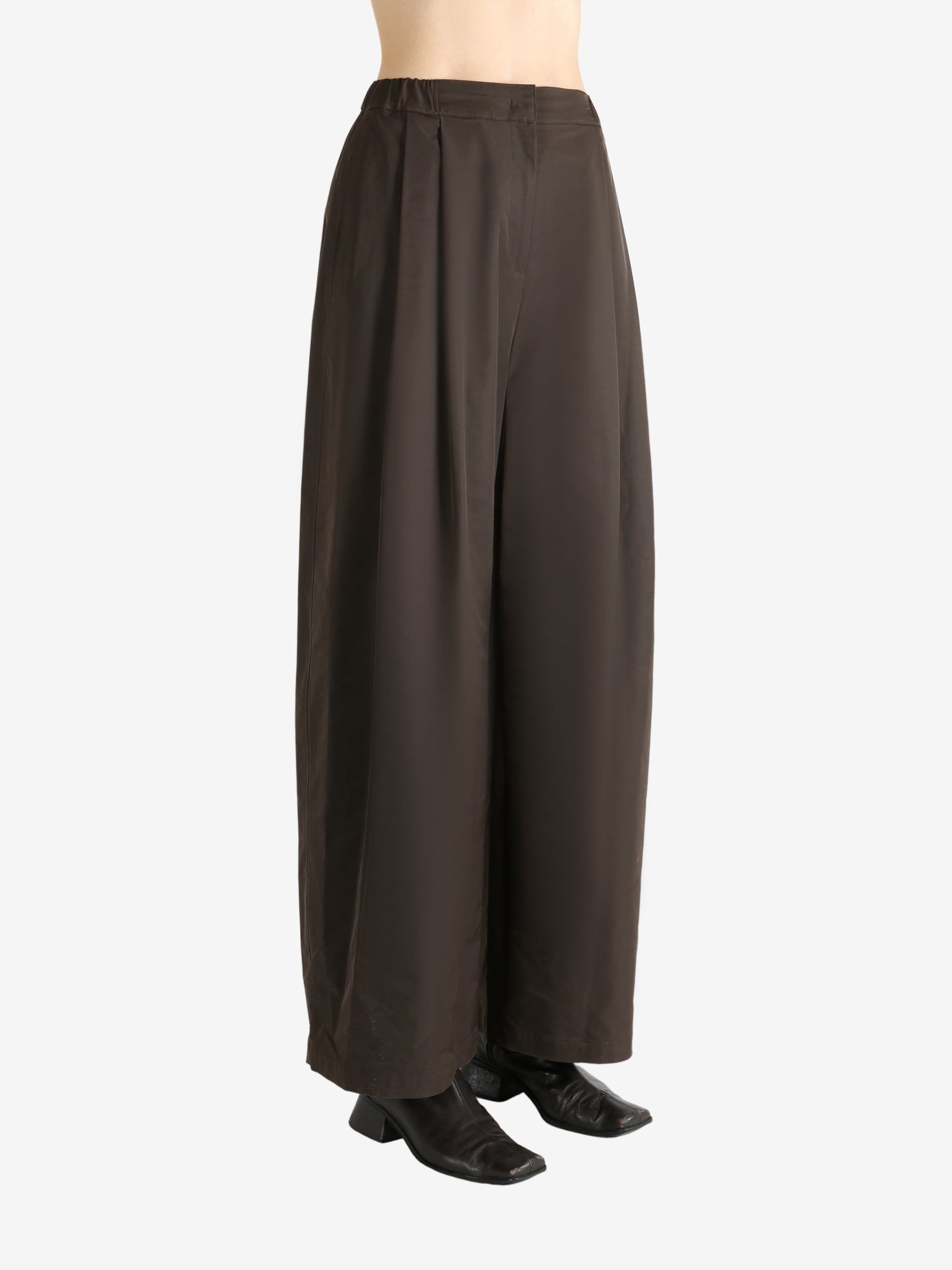 Green pants worn by a person, showing the pants fit