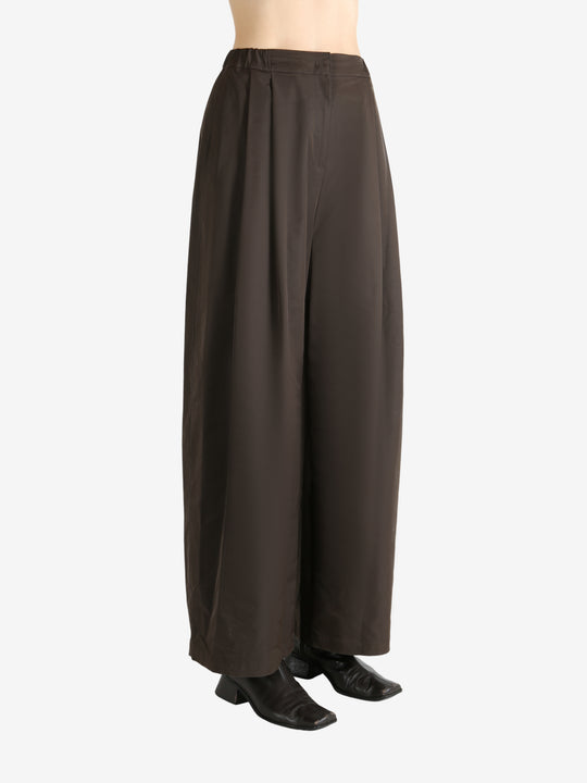 Green pants worn by a person, showing the pants fit