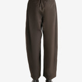 Green pants worn by a person, showing the pants fit