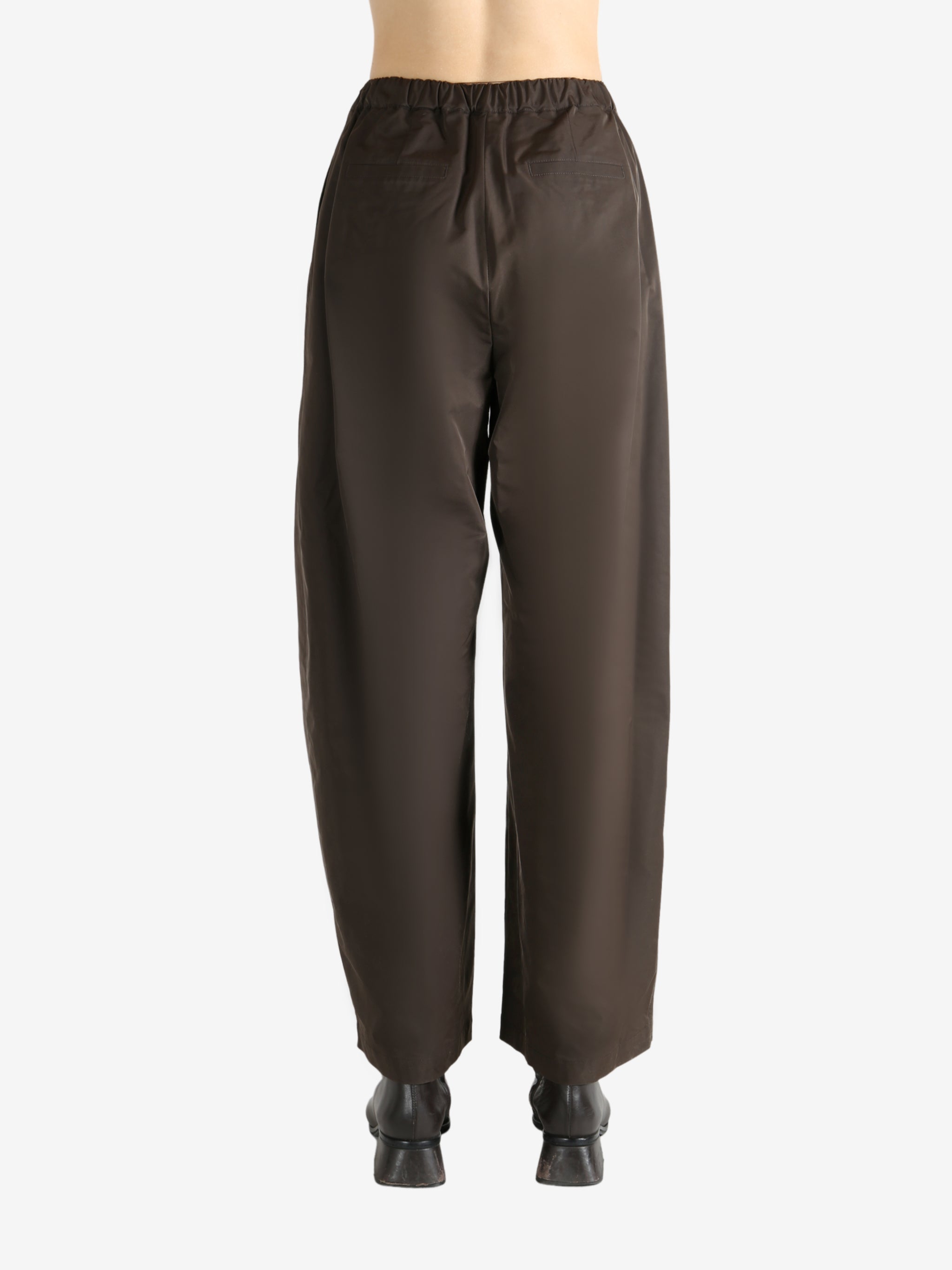 Green pants worn by a person, showing the pants fit