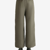 Tan pants worn by a person, showing the pants fit