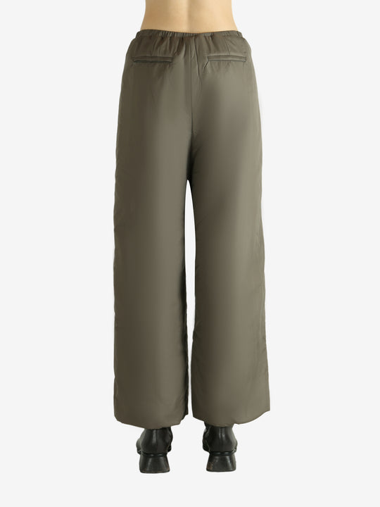 Tan pants worn by a person, showing the pants fit