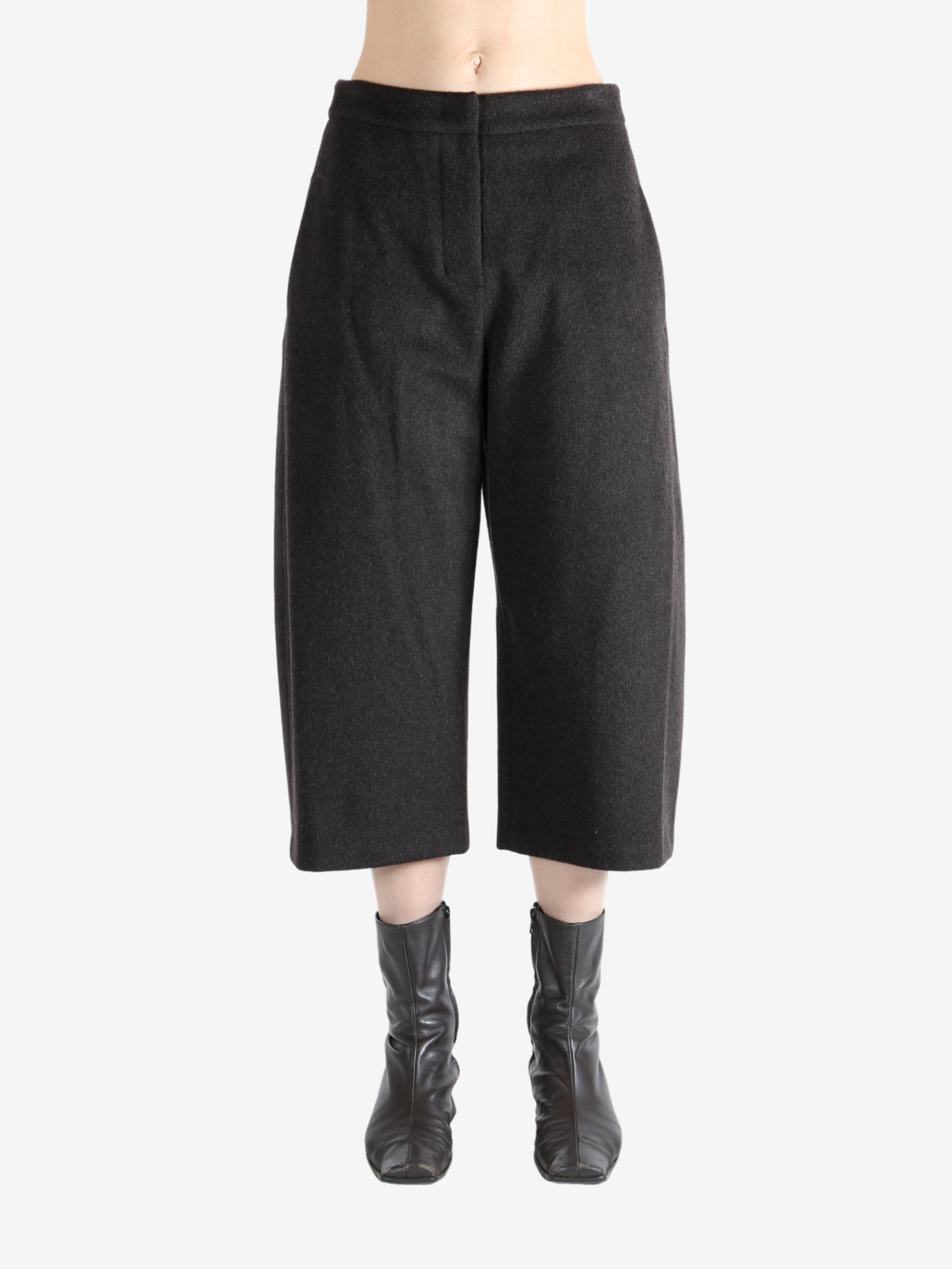 Brown pants worn by a person, showing the pants fit