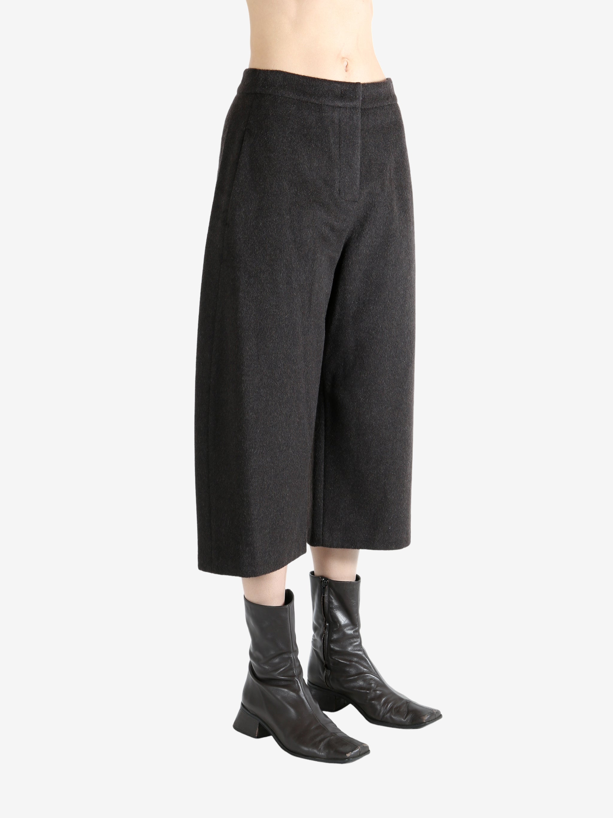 Brown pants worn by a person, showing the pants fit