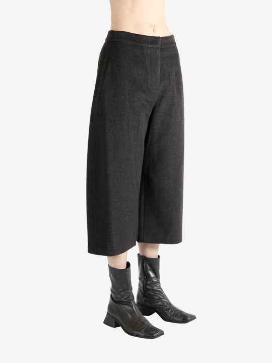 Brown pants worn by a person, showing the pants fit