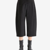 Brown pants worn by a person, showing the pants fit