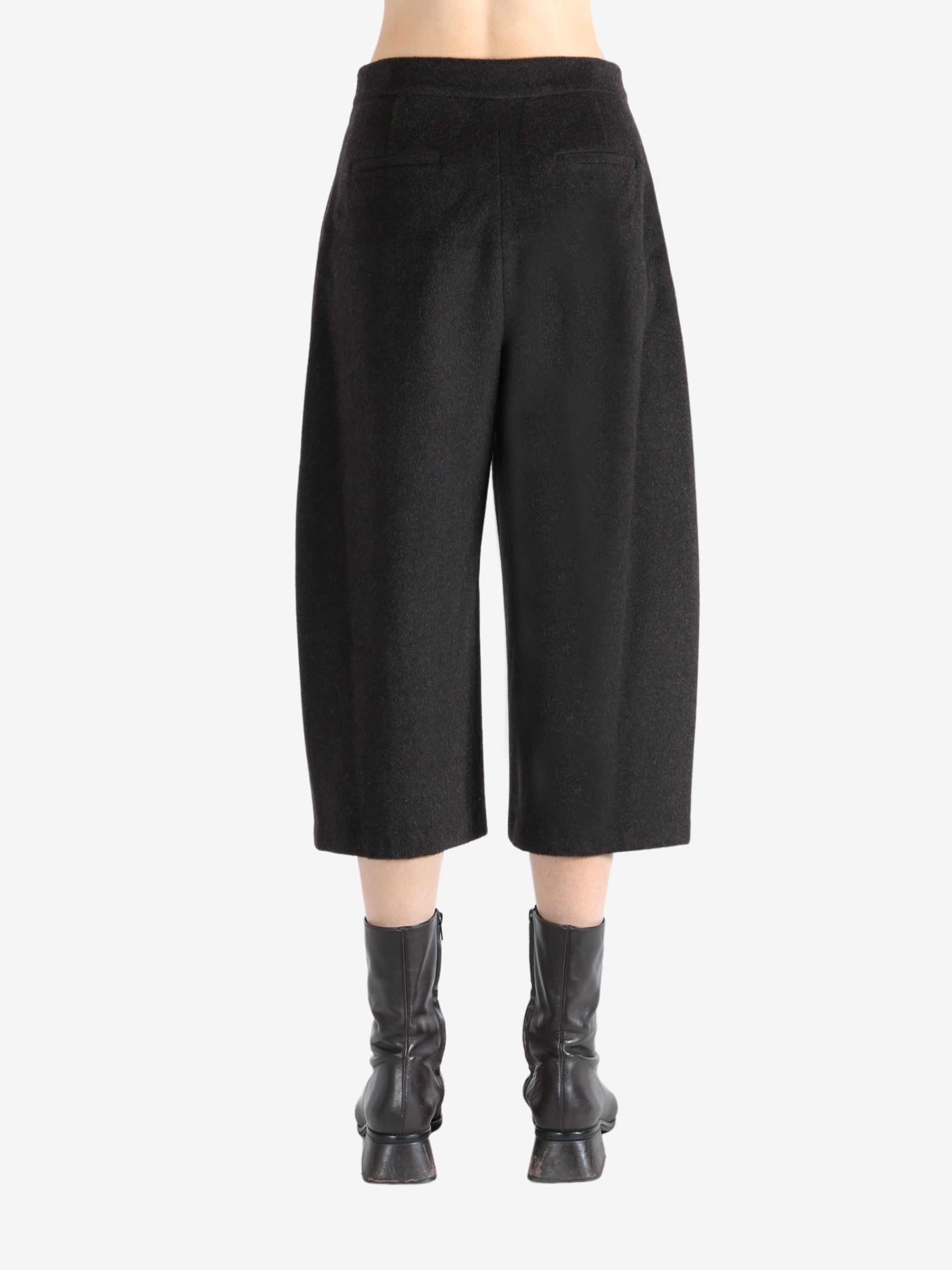 Brown pants worn by a person, showing the pants fit