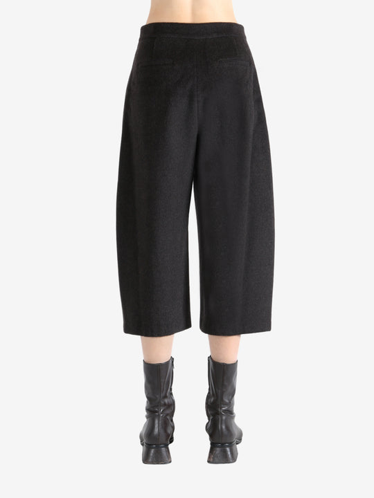 Brown pants worn by a person, showing the pants fit