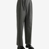 Grey pants worn by a person, showing the pants fit