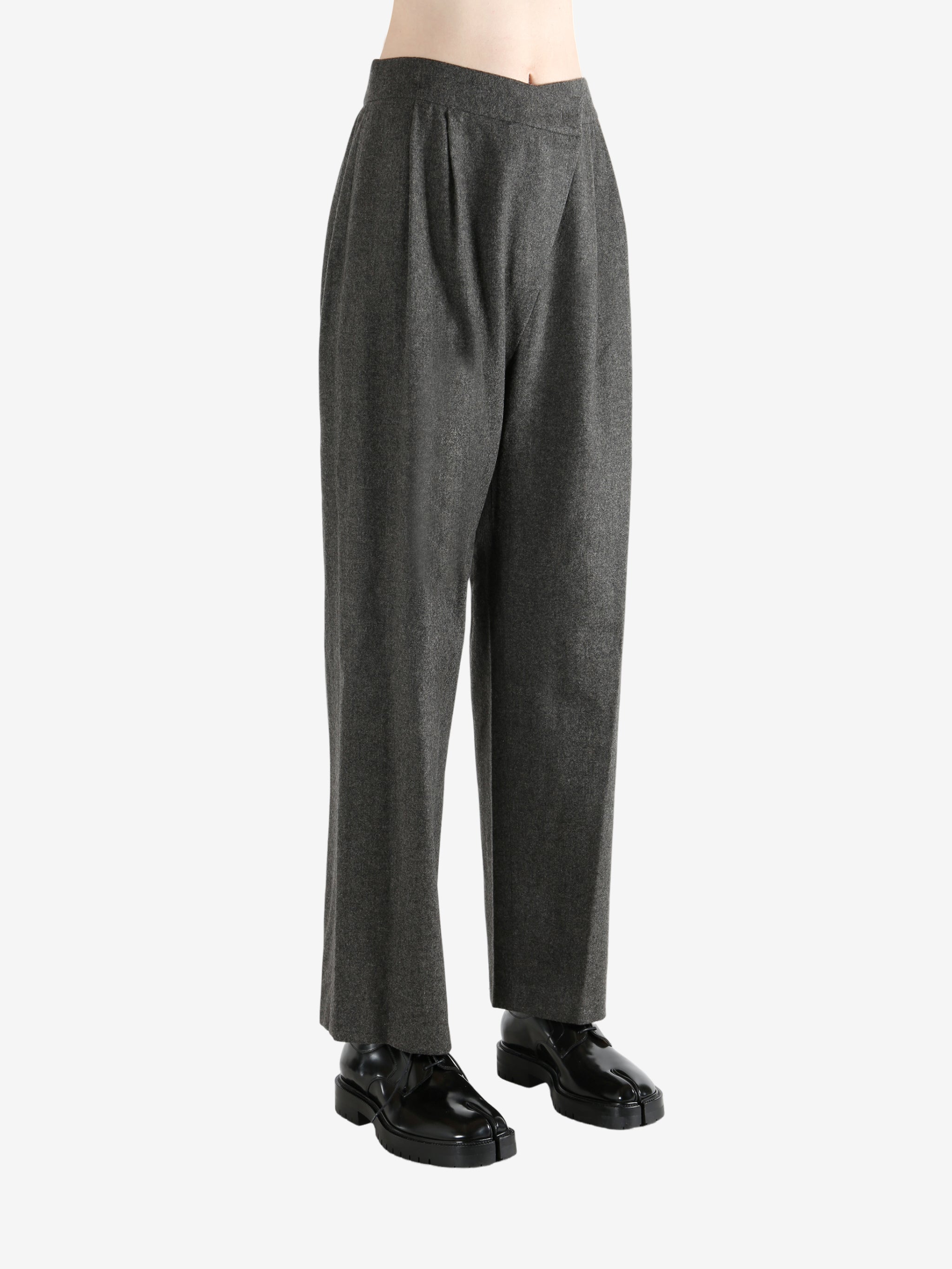 Grey pants worn by a person, showing the pants fit