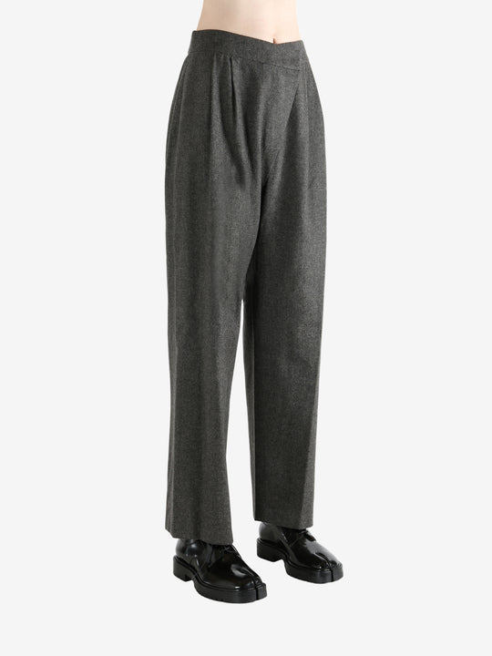 Grey pants worn by a person, showing the pants fit