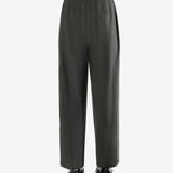 Grey pants worn by a person, showing the pants fit