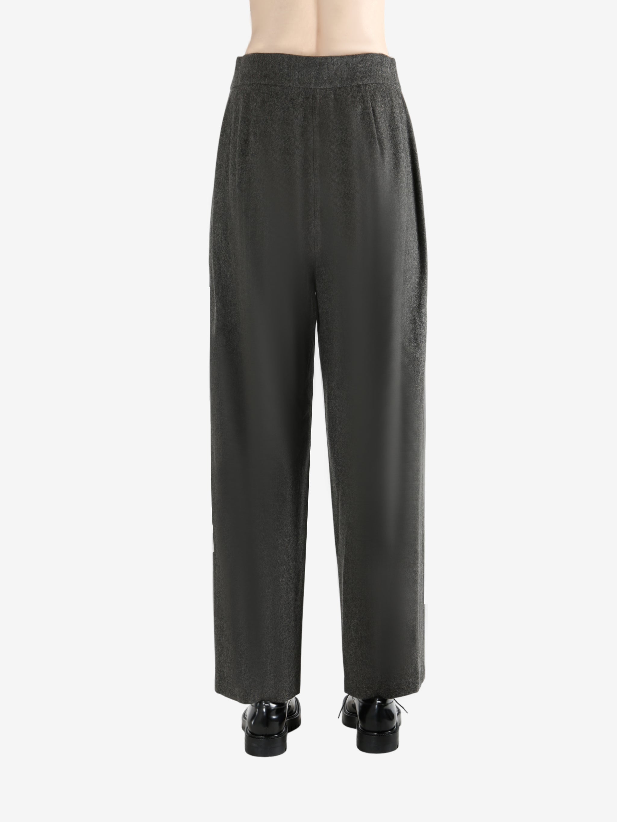 Grey pants worn by a person, showing the pants fit