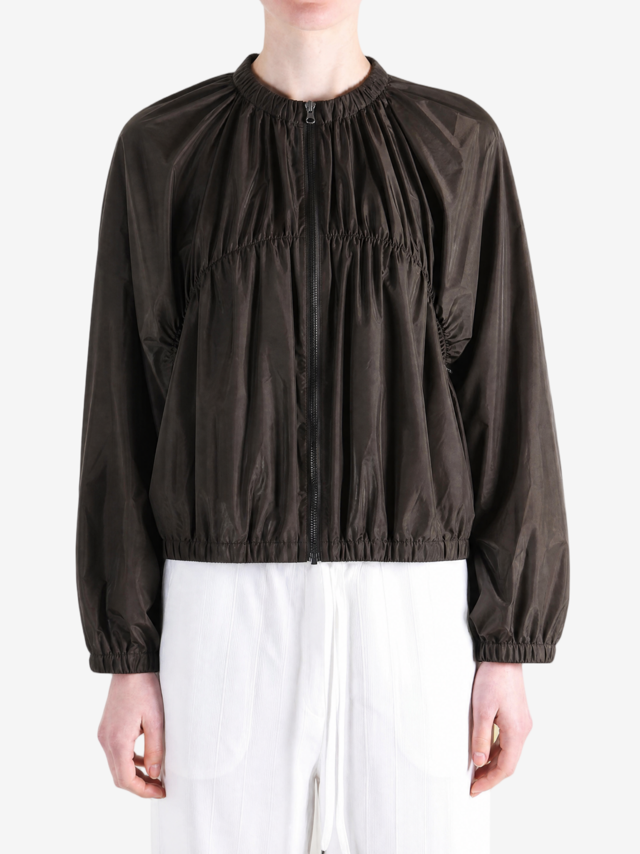 Brown jacket worn by a person, showing the jacket's fit