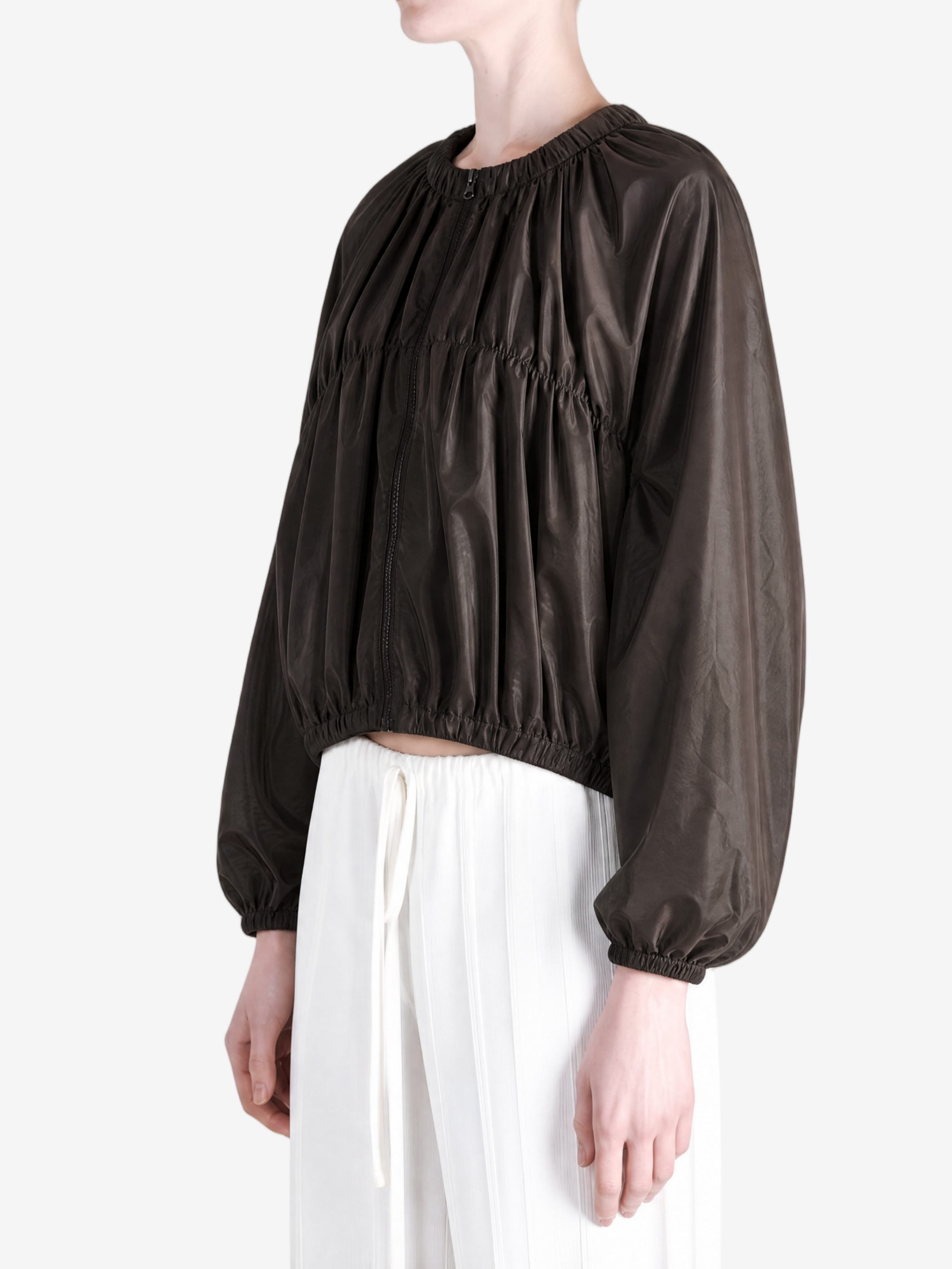 Brown jacket worn by a person, showing the jacket's fit