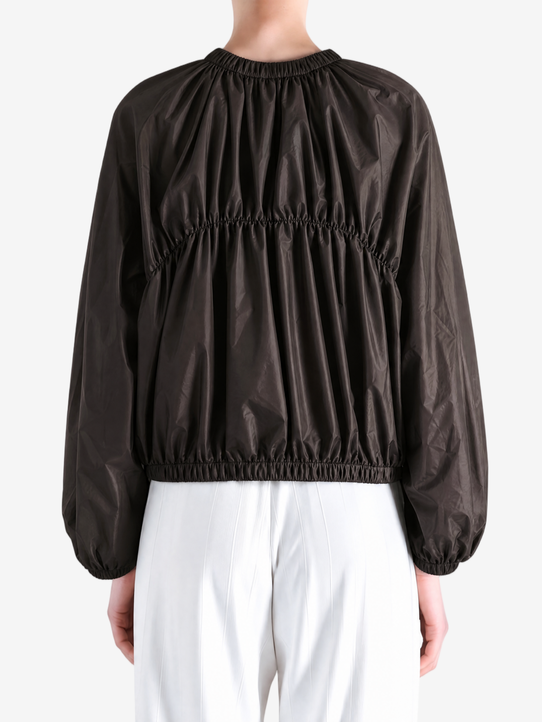 Brown jacket worn by a person, showing the jacket's fit