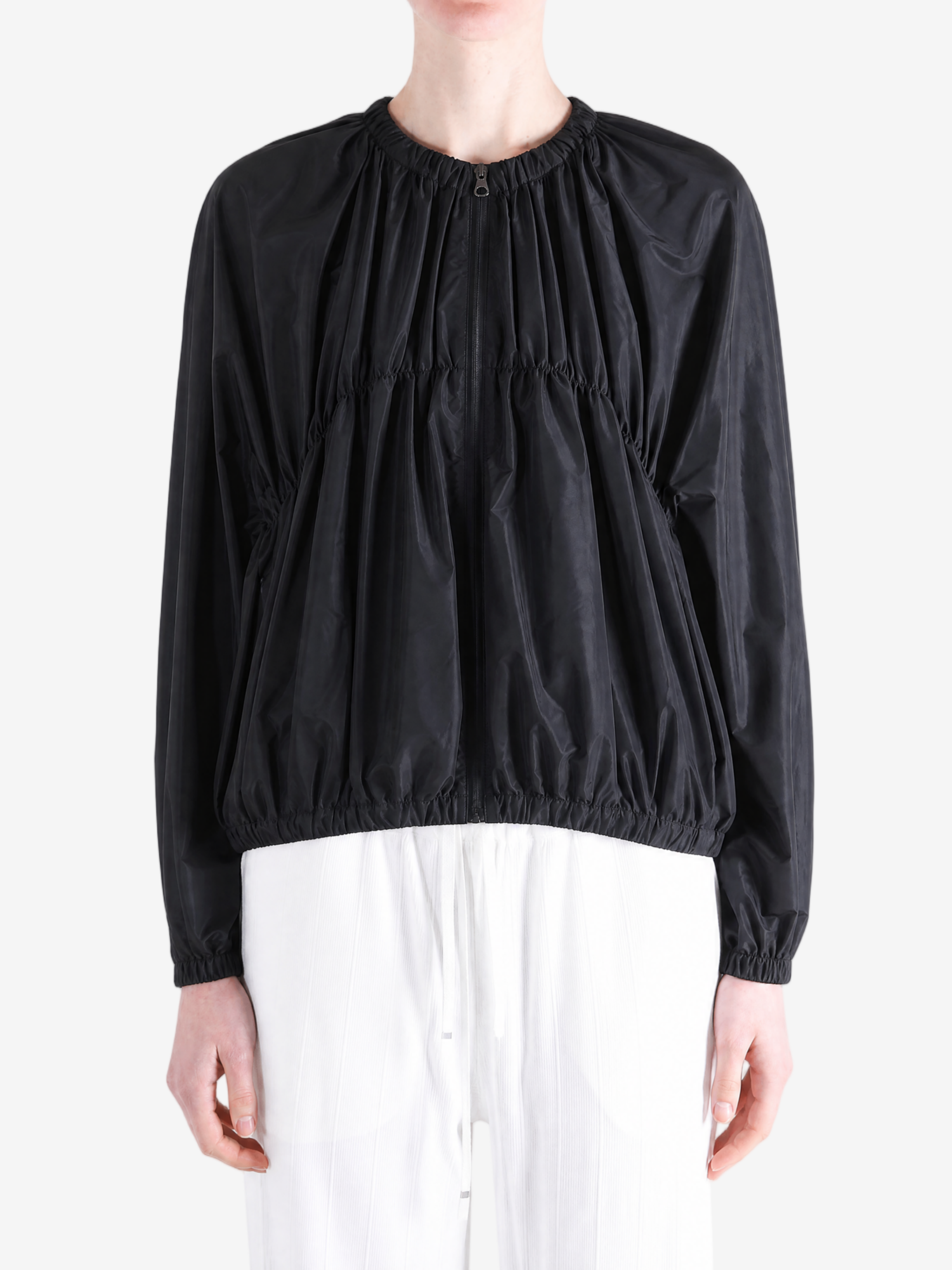 Black jacket worn by a person, showing the jacket's fit