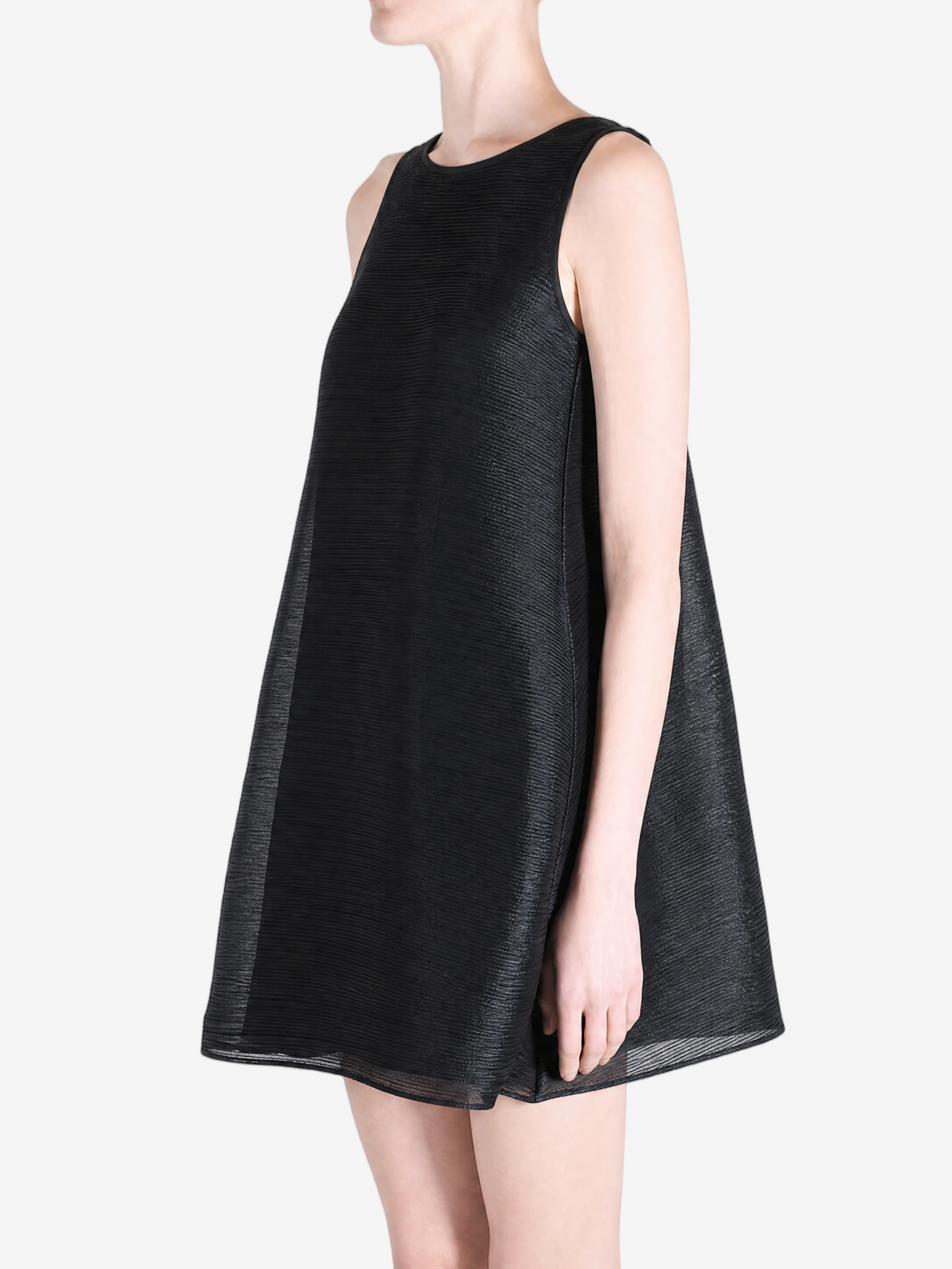 Black dress worn by a person, side view