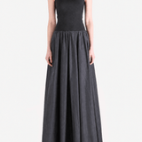 Black dress worn by a person, showing the dress fit