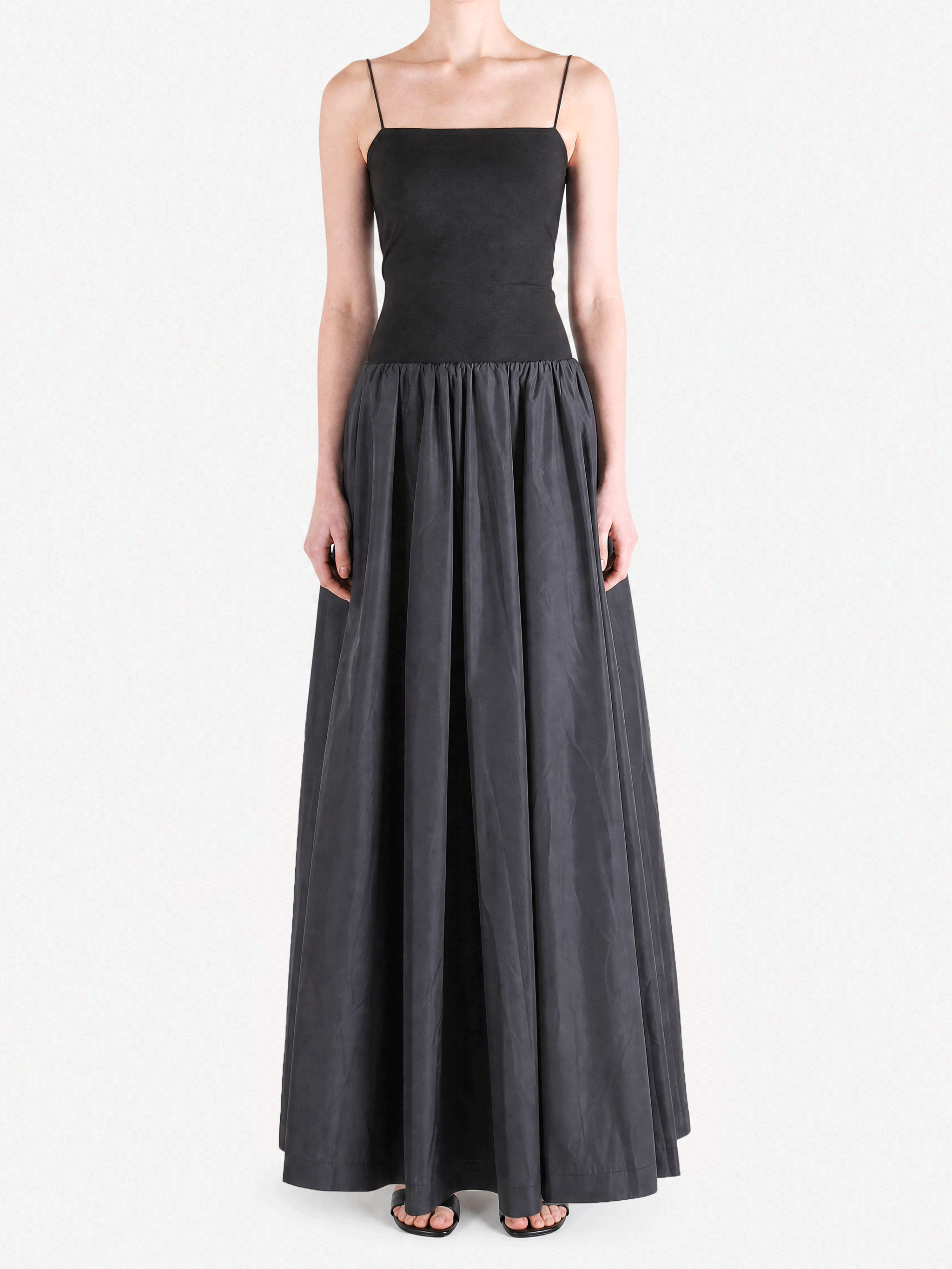 Black dress worn by a person, showing the dress fit