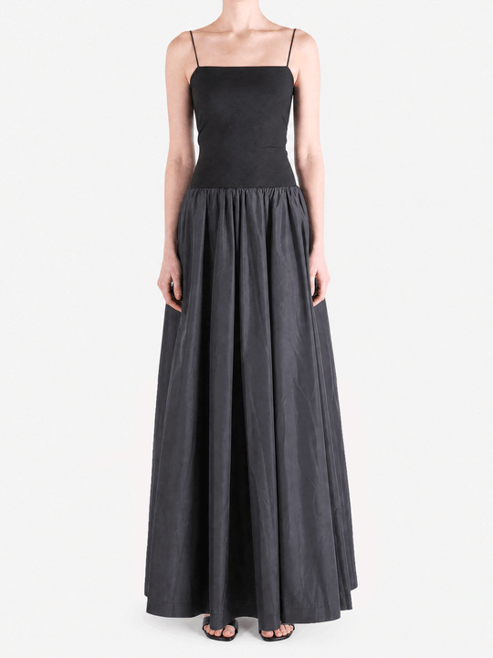 Black dress worn by a person, showing the dress fit
