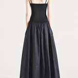 Black dress worn by a person, back view
